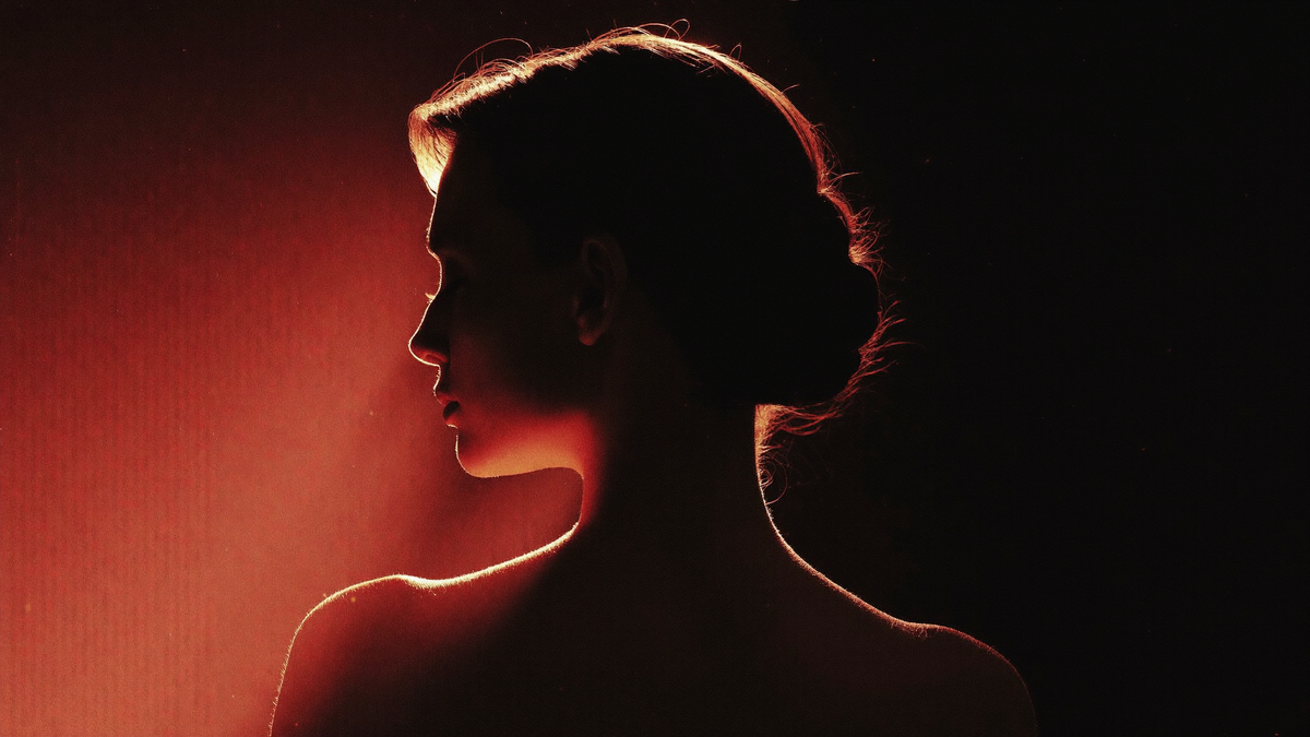 Red-lit silhouette — home hero slide