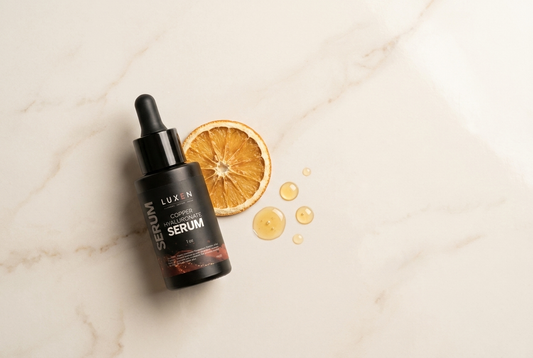 PRE-LIGHT Copper Peptide Serum styled near a citrus accent representing vitamin C pairing