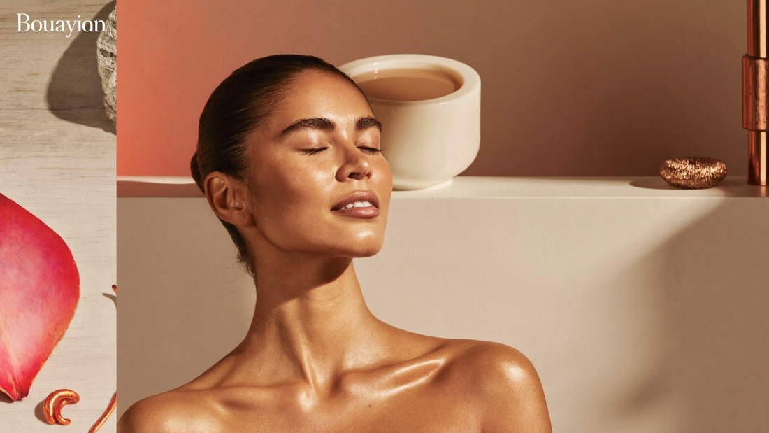 Serene woman with even-toned skin in warm golden spa lighting, editorial wellness setting