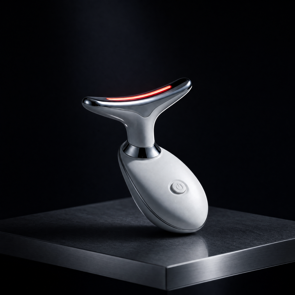 Luxen Sculpt & Glow Wand on a brushed-steel plinth in a dark studio, red LED lit