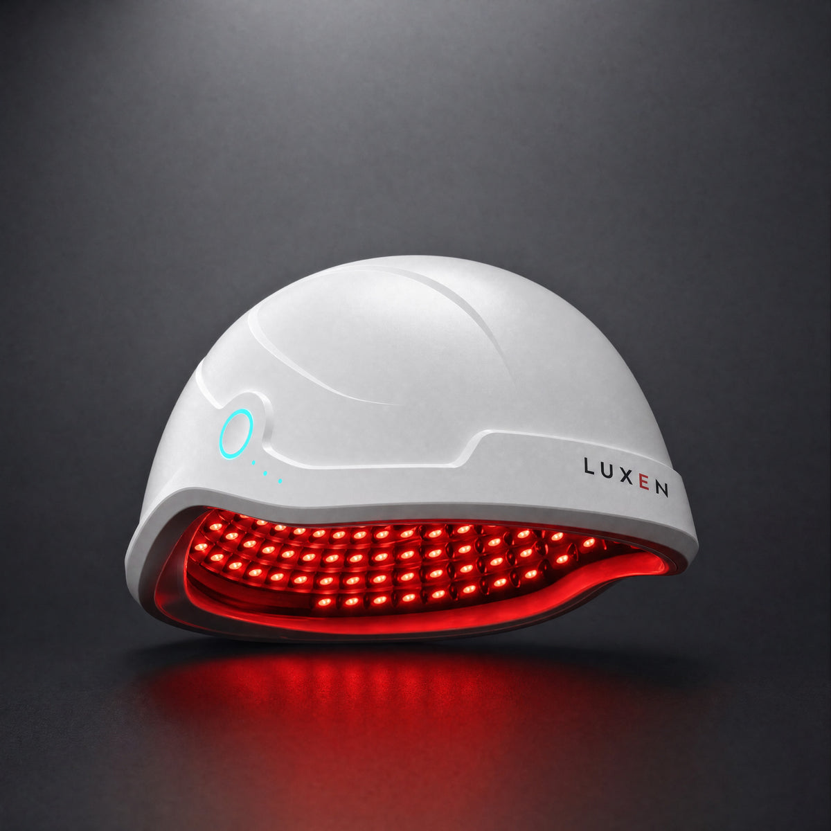 Luxen Laser Cap switched on, red laser light shining from the underside