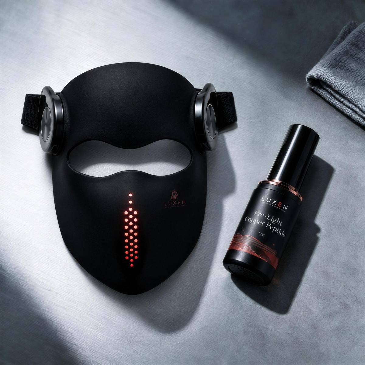 Black Luxen Veil mask and Pre-Light serum, flat lay