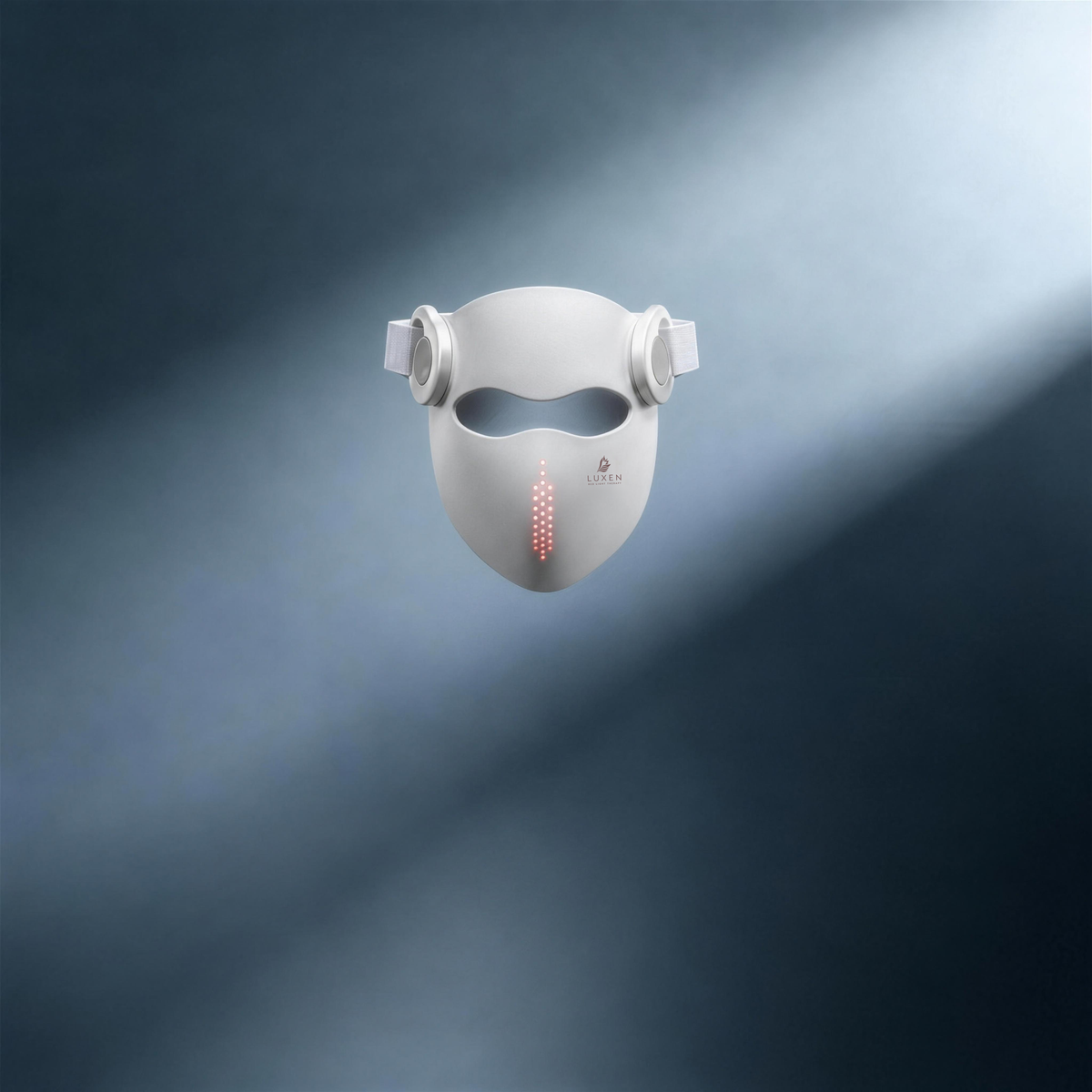 White Luxen Veil mask floating in a shaft of light on steel gray